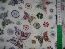Tkanina bawełniana - kolorowe motyle na kremie -- 1001